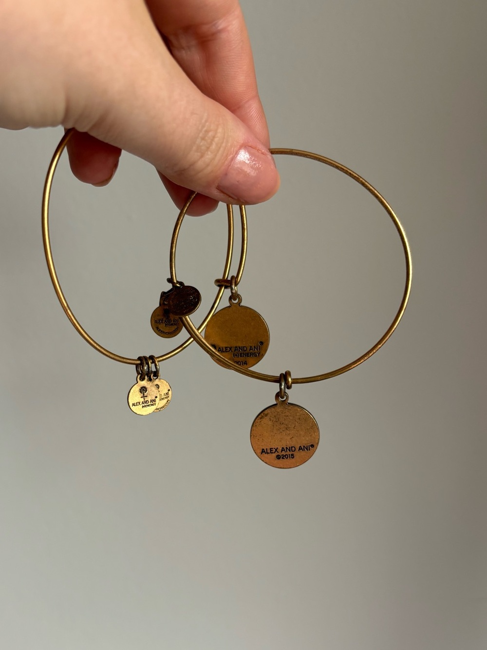 2 Alex and ani gold toned expendable bangles